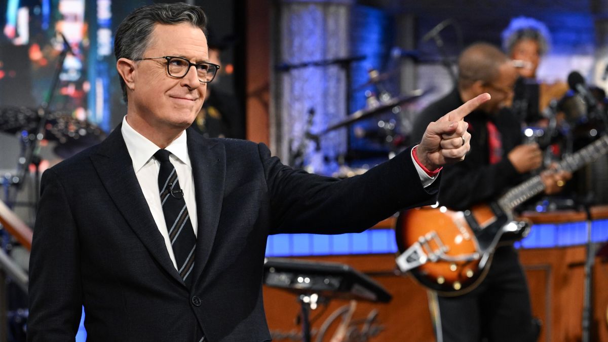 Stephen Colbert smiling and pointing in The Late Show with Stephen Colbert