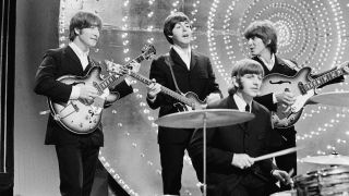 The Beatles perform 'Rain' and 'Paperback Writer' on BBC TV show 'Top Of The Pops' in London on 16th June 1966. Left to right: John Lennon (1940-1980), Paul McCartney, Ringo Starr and George Harrison