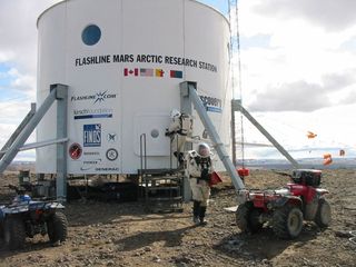 Situated at 75 degrees north, roughly 900 miles from the North Pole, Flashline Mars Arctic Research Station is located adjacent to a 20 kilometer meteor impact crater in the midst of a polar desert that is known to represent one of the most Mars-like environments on Earth.