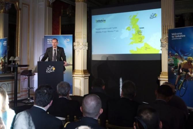 General director of the Tour de France Christian Prudhomme delivers a speech next to a map of Great Britain in Paris, during the official presentation of the 2014 Tour de France's "Grand depart"