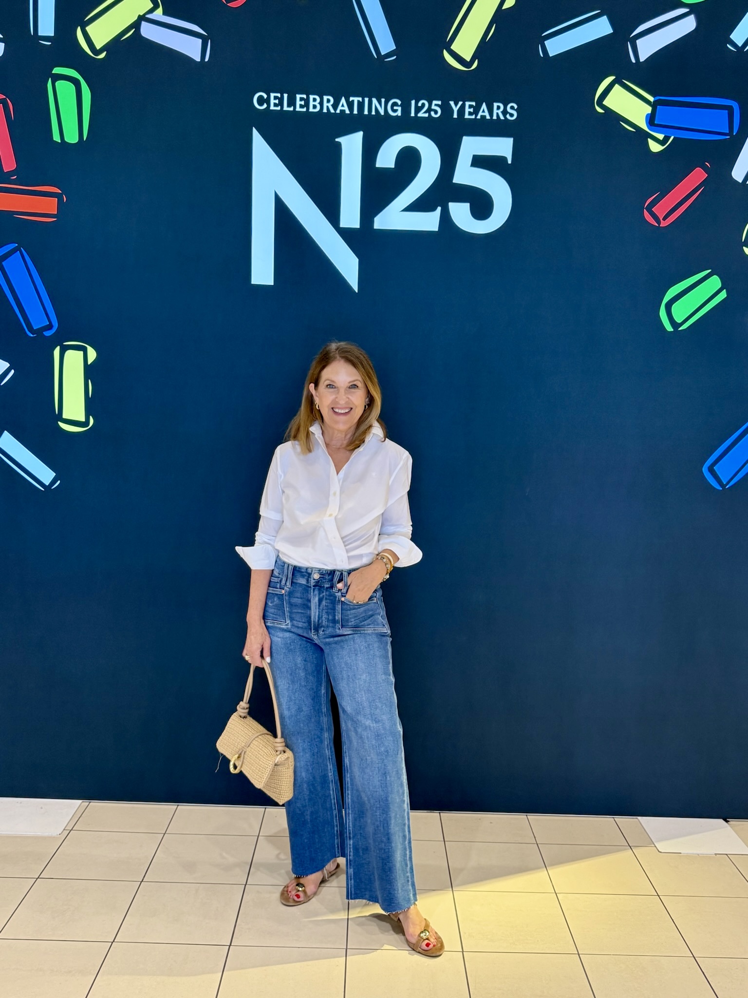 Sandy Koszarek wearing a white tee and jeans.