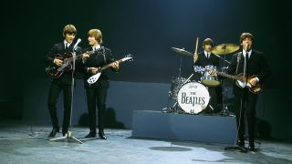 George Harrison, John Lennon, Ringo Starr and Paul McCartney of English rock and pop group The Beatles perform together on stage for the American Broadcasting Company (ABC) music television show 'Shindig!' at Granville Studios in Fulham, London on 3rd October 1964.