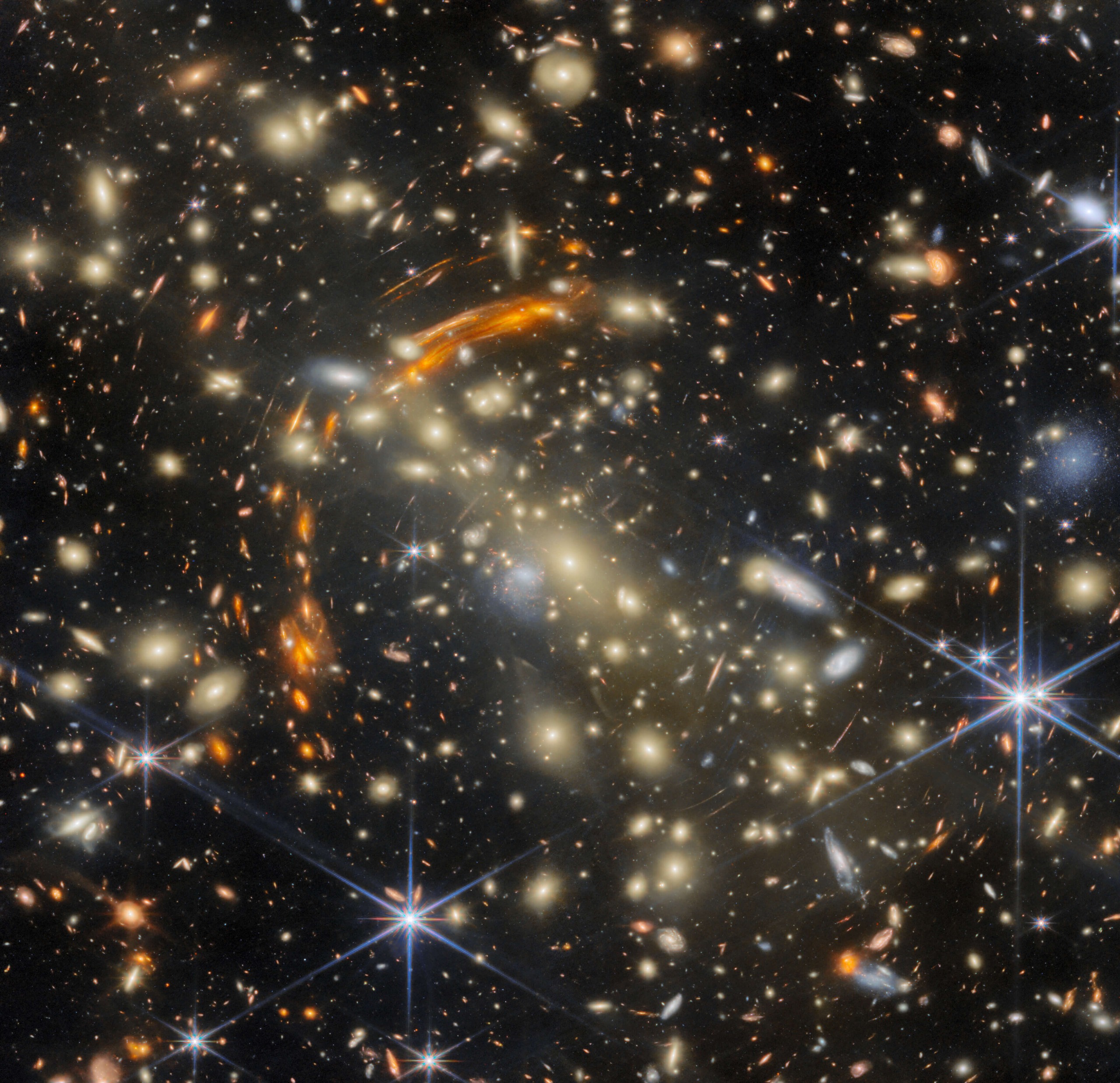 Galaxy cluster gravitationally lensing another, more distant galaxy cluster.