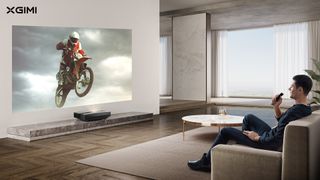XGIMI AURA projecting a motorcycle in a living room