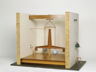 Model of torsion balance.