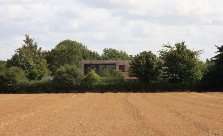 Meadowview House looms with the surrounding landscape of seasonal crops and agricultural structures