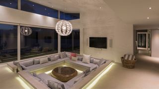 A living room with a sunken seating area