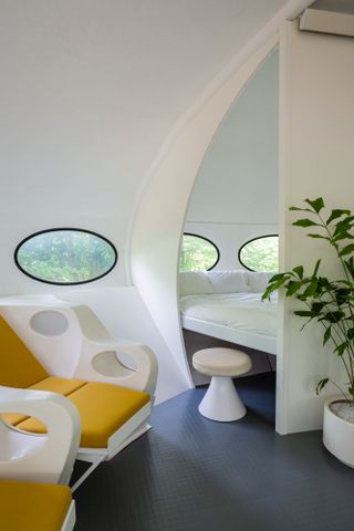 futuristic 1960s Futuro House's streamlines interior looking towards the sleeping pod