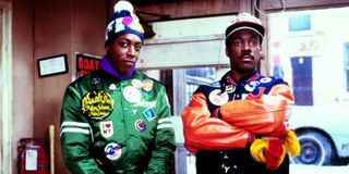 Arsenio Hall and Eddie Murphy as Semmi and Akeem in Coming to America