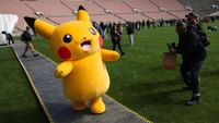 A Pikachu character walks across the field after posing for pictures with fans during the in-person Pokemon GO Tour: Kalos Los Angeles 2026 event at the Rose Bowl Stadium in Pasadena, California on February 20, 2026. Pokemon fans around the world continue to engage with the media franchise in various formats including video games, trading cards, animated series, and movies ahead of the 30th anniversary of Pok&eacute;mon next week. (Photo by Patrick T. Fallon / AFP via Getty Images)