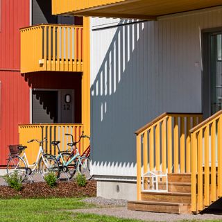 Ikea house with yellow stairs and bicycle