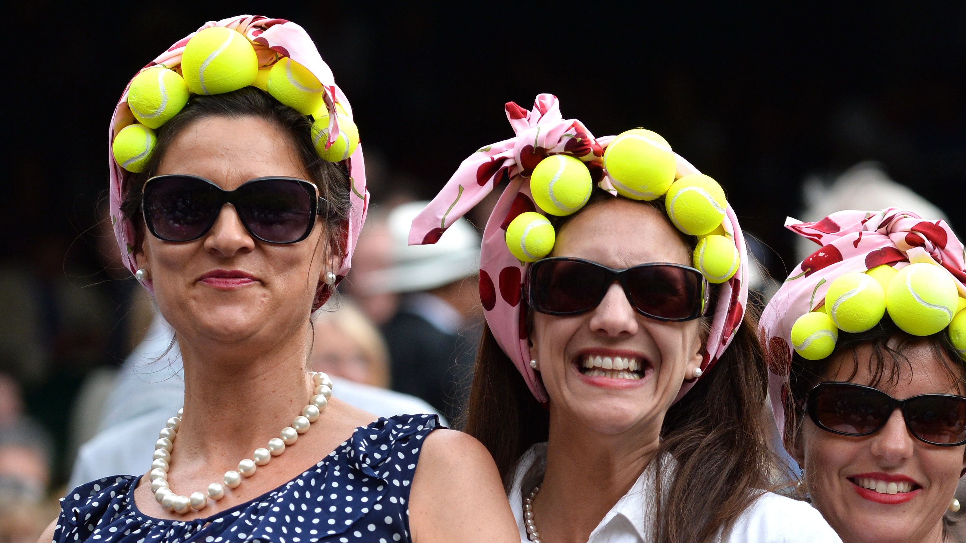 LONDON, ENGLAND - JUNE 26: Tennis fans at the Gilles Muller v Roger Federer match on centre court during day four of the Wimbledon Championships at Wimbledon in London, England. (Photo by Karwai Tang/WireImage)