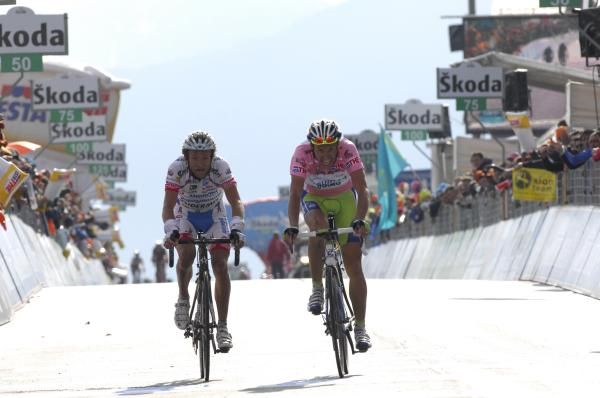 Ivan Basso (Liquigas-Doimo) and Michele Scarponi (Androni Giocattoli) are relieved to finish a long day in the mountains.