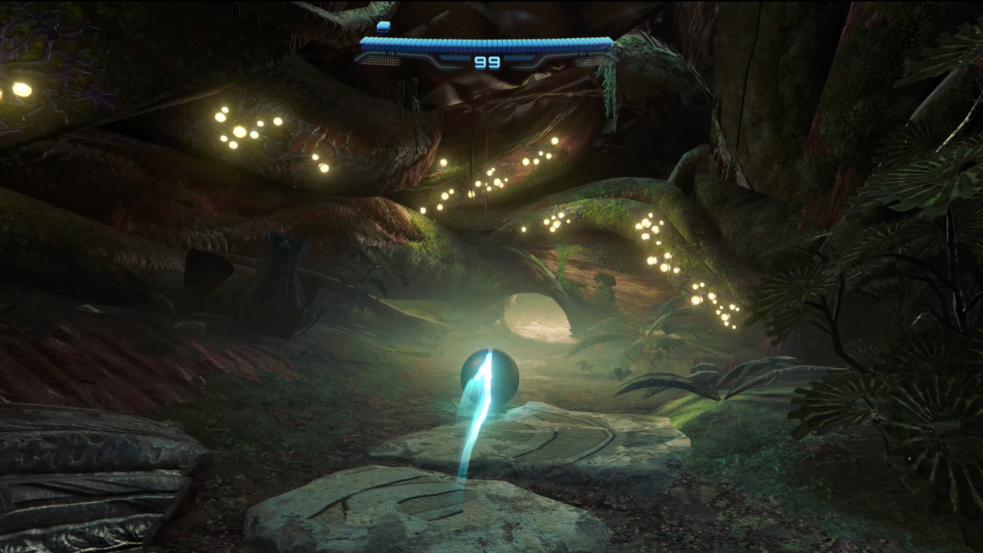 A screenshot shows Morph Ball Samus diving through a knot of tree roots