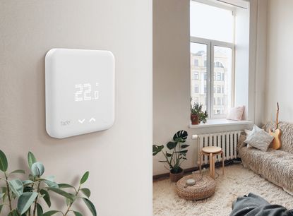 Best energy supplier: Tado smart thermostat on wall in living room