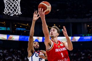 Franz Wagner #9 of Germany drives to the basket against Mikal Bridges #5 of the United States during the FIBA Basketball World Cup Semi Final game between USA and Germany on September 8, 2023.
