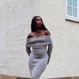 Woman wearing a grey knit dress