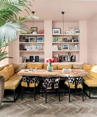 Pink dining room with built in shelving