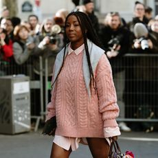 woman wearing a pink sweater 