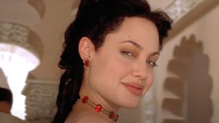 Angelia Jolie smiles as she walks past the camera in Original Sin.