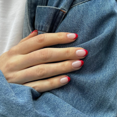 Red-tipped french manicure on almond nails