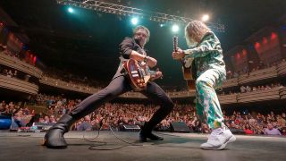 The Roland brothers on stage with Collective Soul with the audience behind them