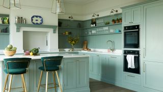pale green kitchen with open shelving