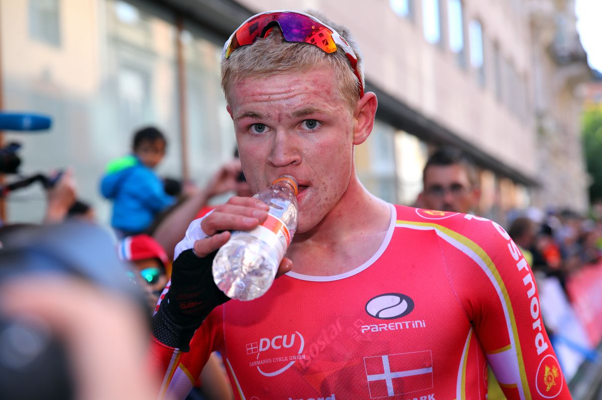 Julius Johansen (Denmark) takes a drink after his solo win