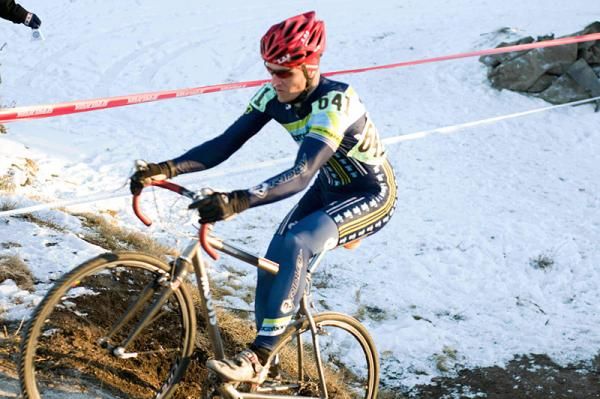 Eric Goodson (Embrocation Cycling) powers up one of the six-foot berms as the sun begins to set.