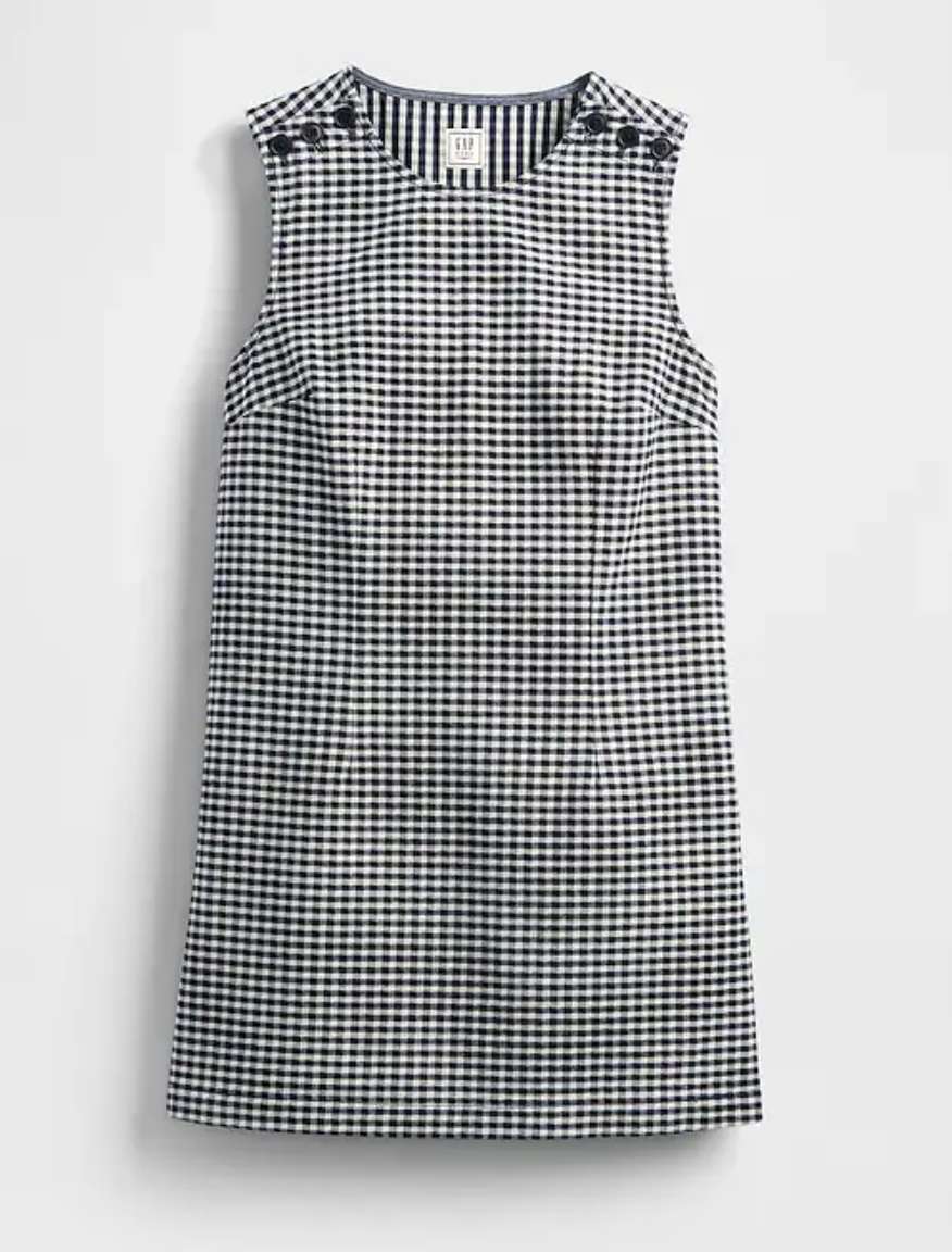 a gingham gap dress on a plain backdrop