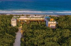 Ariel shot of the jungle retreat looking out into the ocean