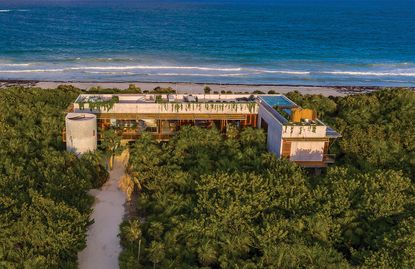 Ariel shot of the jungle retreat looking out into the ocean