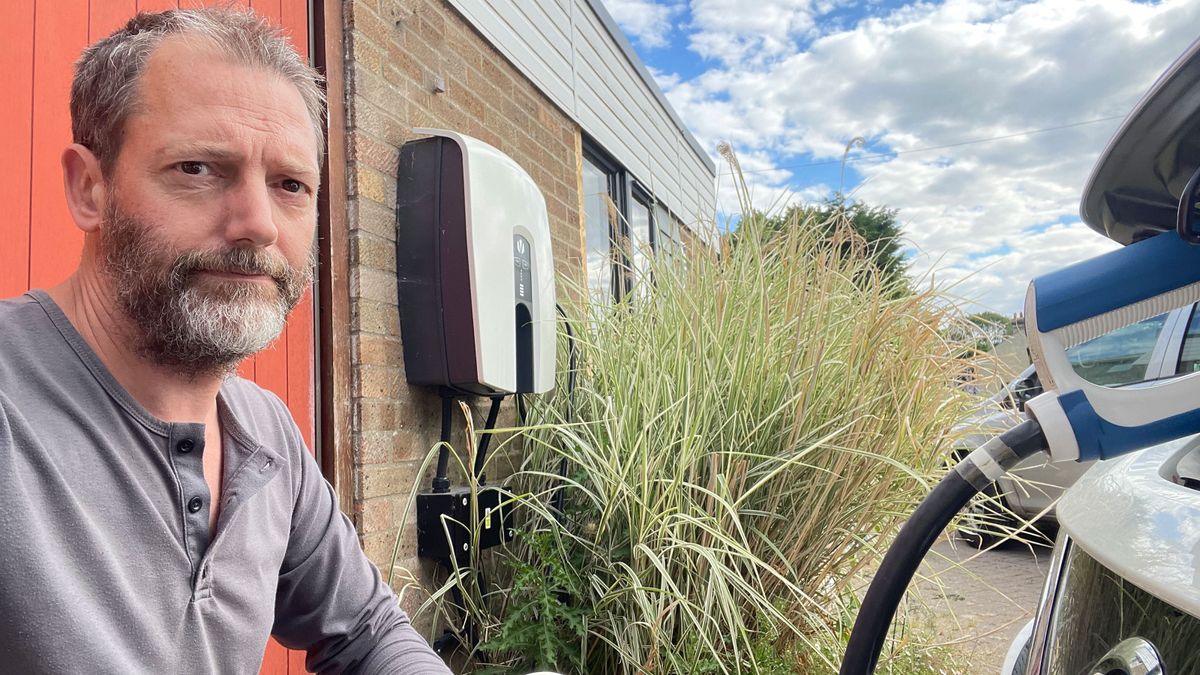 Paul Kershaw is pictured to the left with his electric vehicle on his driveway