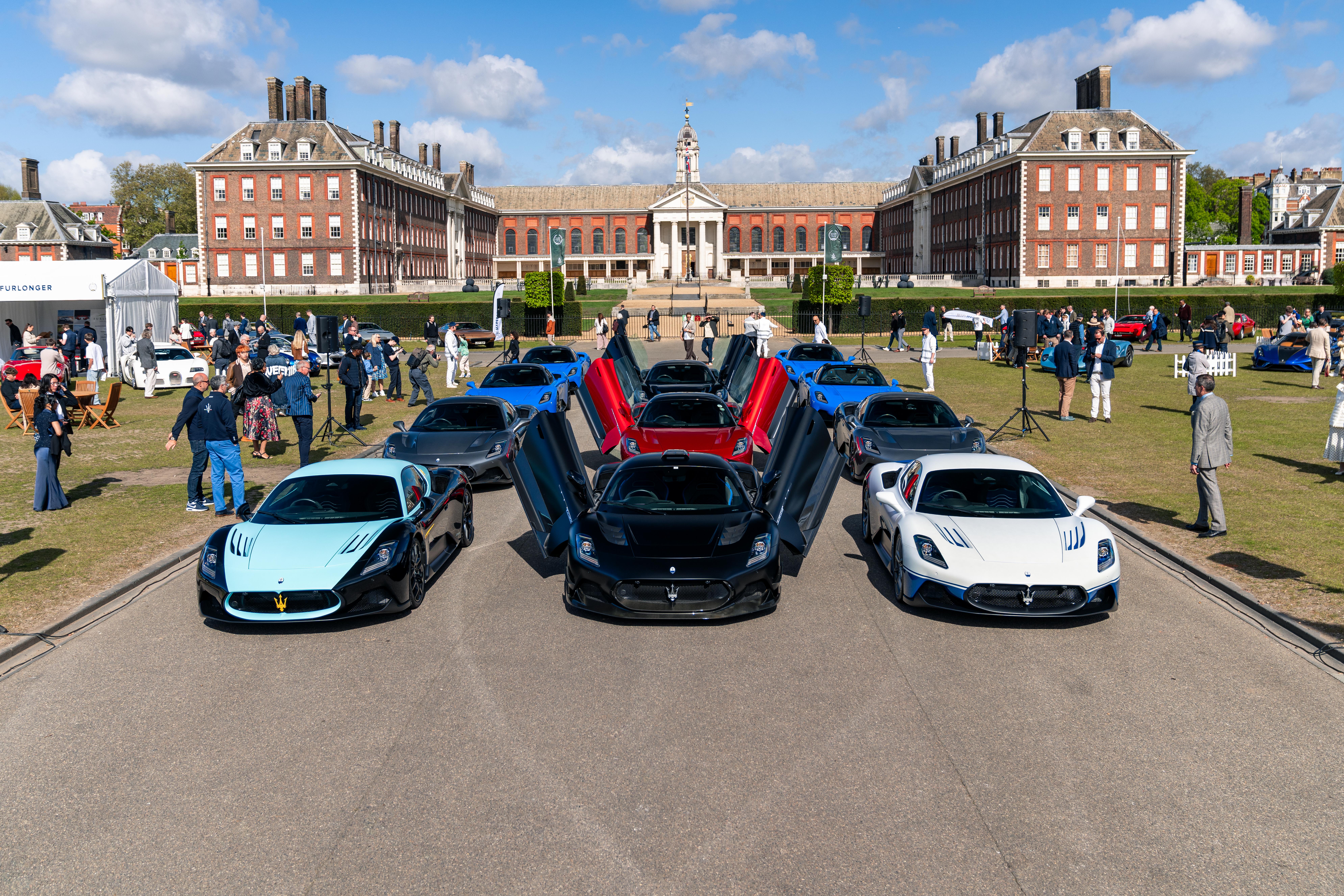 A row of Maseratis with their doors open