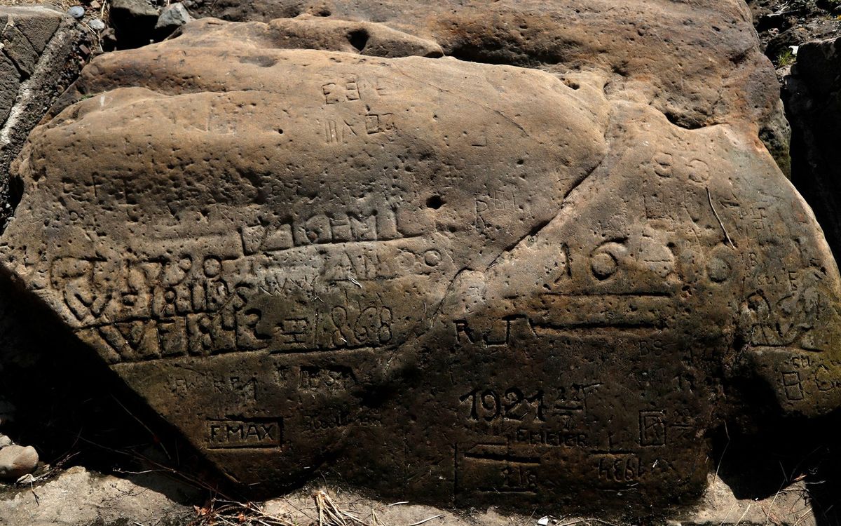 One of the &quot;hunger stones&quot; exposed by the low level of water in the Elbe river is seen in Decin, Czech Republic