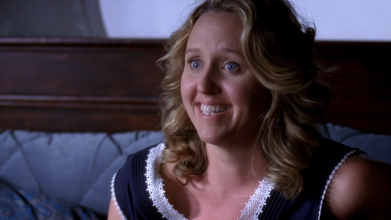 Erica Hahn smiling in bed after having sex with Callie