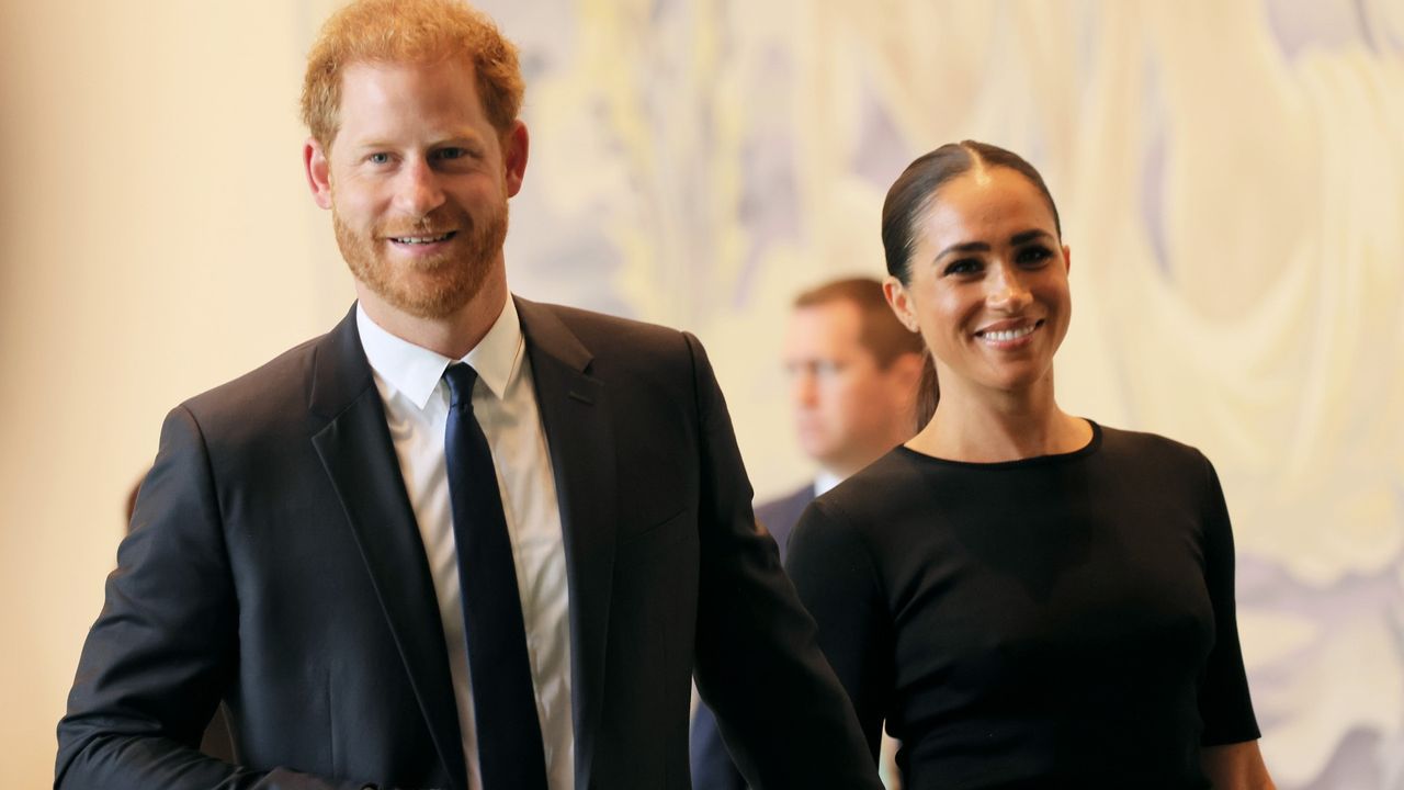 Prince Harry and Meghan Markle walk side by side