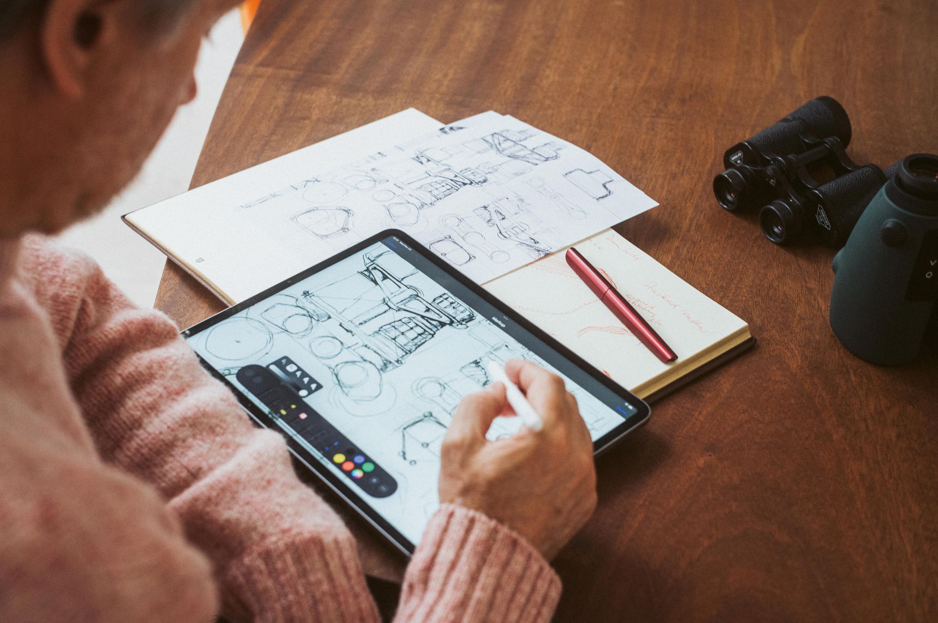 Marc Newson with plans on a tablet