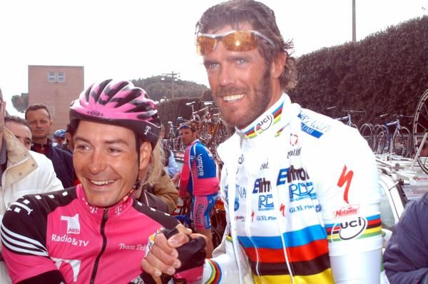 Erik Zabel and Mario Cipollini share a joke at the 2003 Tirreno-Adriatico.