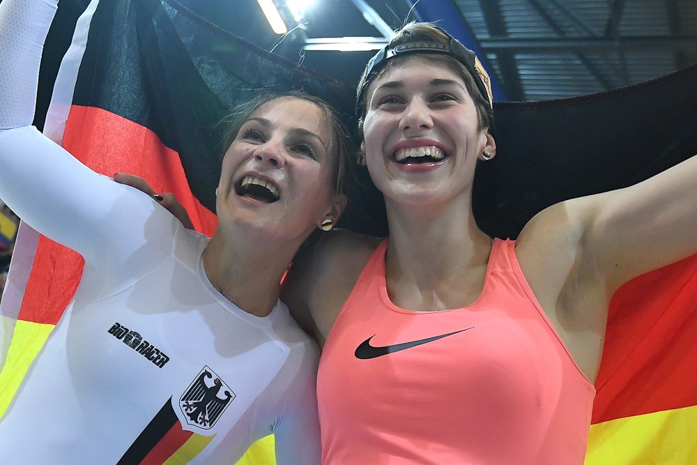 Gold medalist Germany's Kristina Vogel (L) and Bronze medalist Germany's Pauline Sophie Grabosch celebrate after women's sprint final during the UCI Track Cycling World Championships