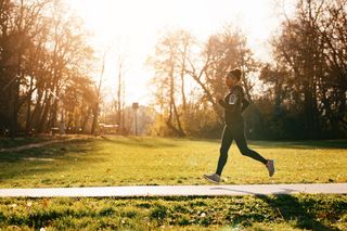 Woman learning how to start running in nature