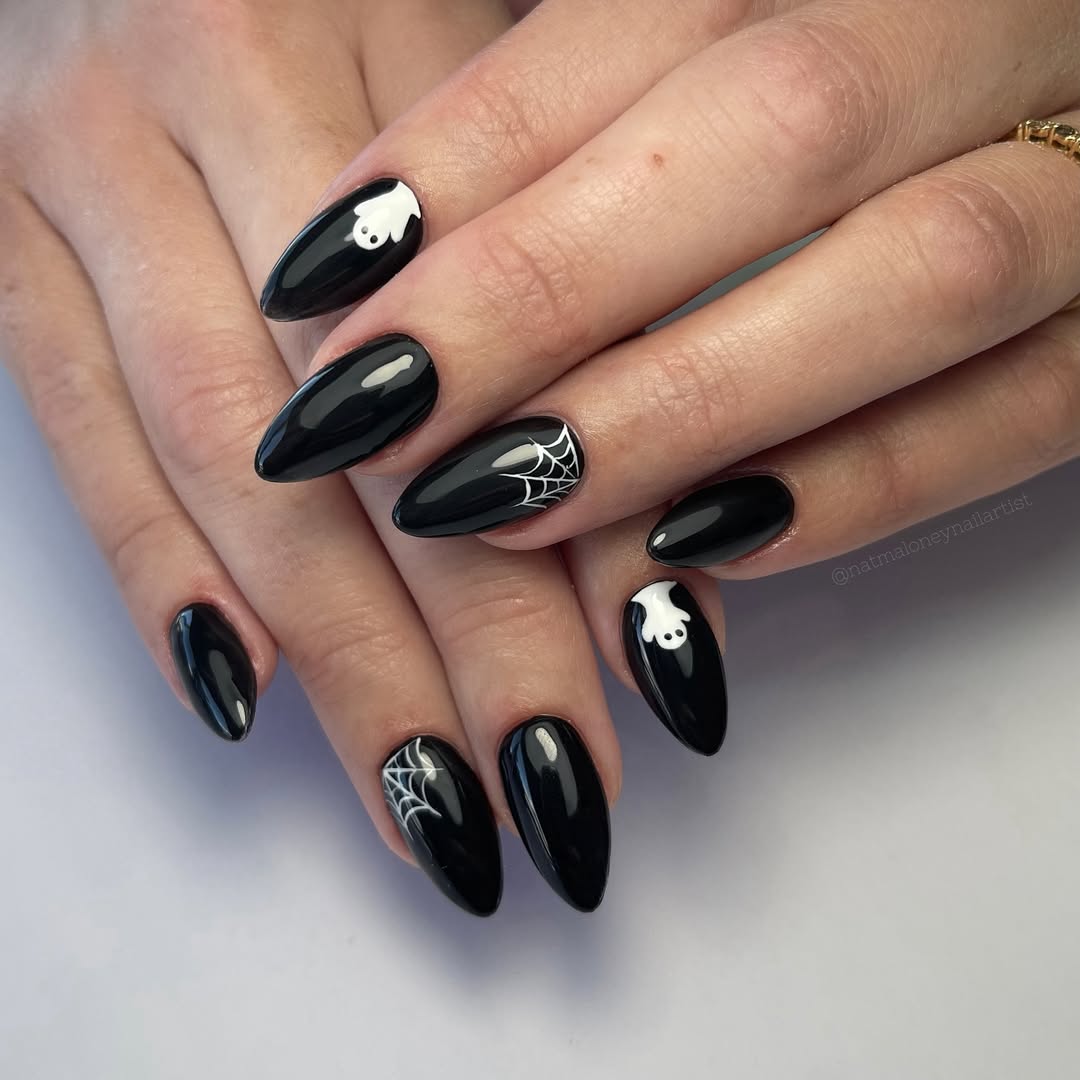 black and white ghost and spiderweb halloween nail art
