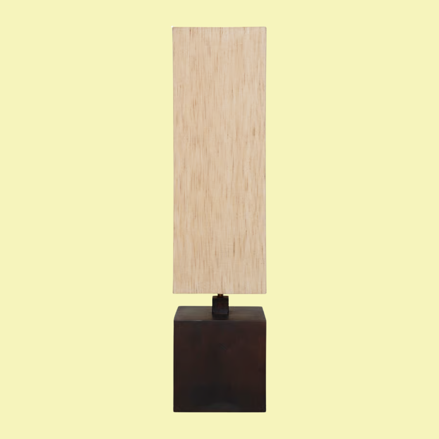 A floor lamp with a wood base and a beige shade