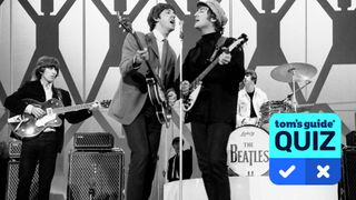 A black and white photo of The Beatles singing on stage on 1 August 1965. Left to right: George Harrison, Paul McCartney, John Lennon, and Ringo Starr. Overlaid is the Tom's Guide quiz badge