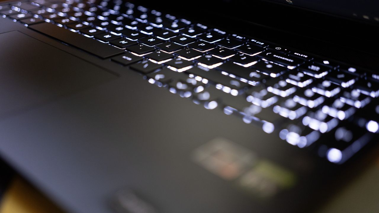 An HP Victus 15 laptop on a colourful table