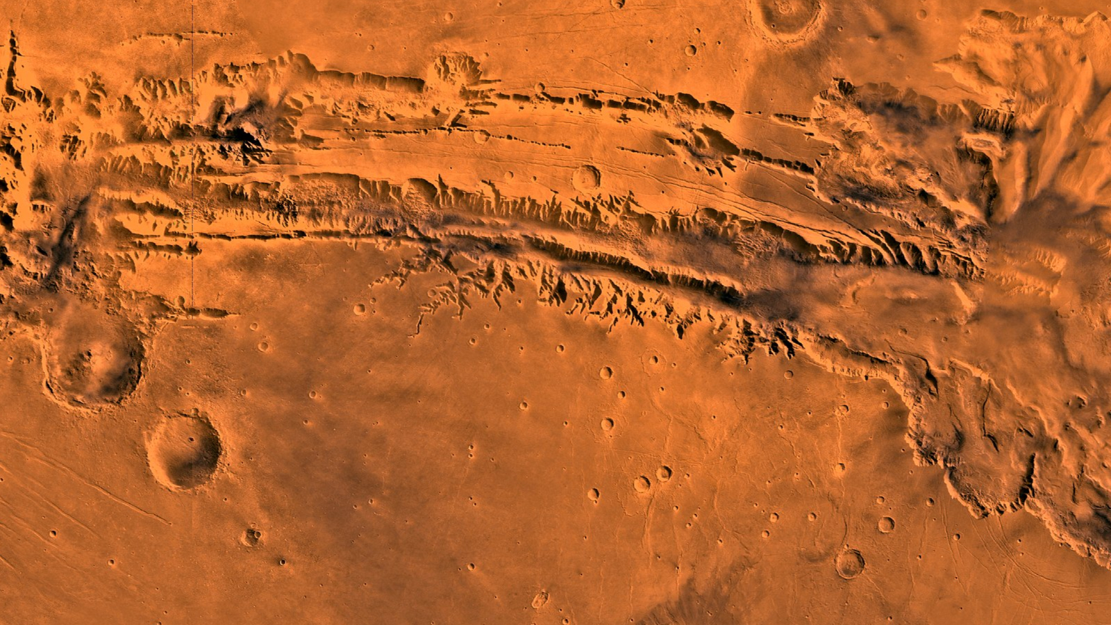 An orange red surface with streaks through it moving left to right