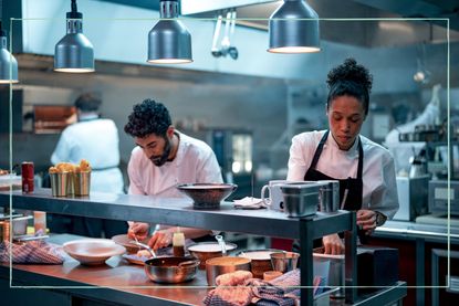 The Boiling Point chefs working behind the pass in the kitchen