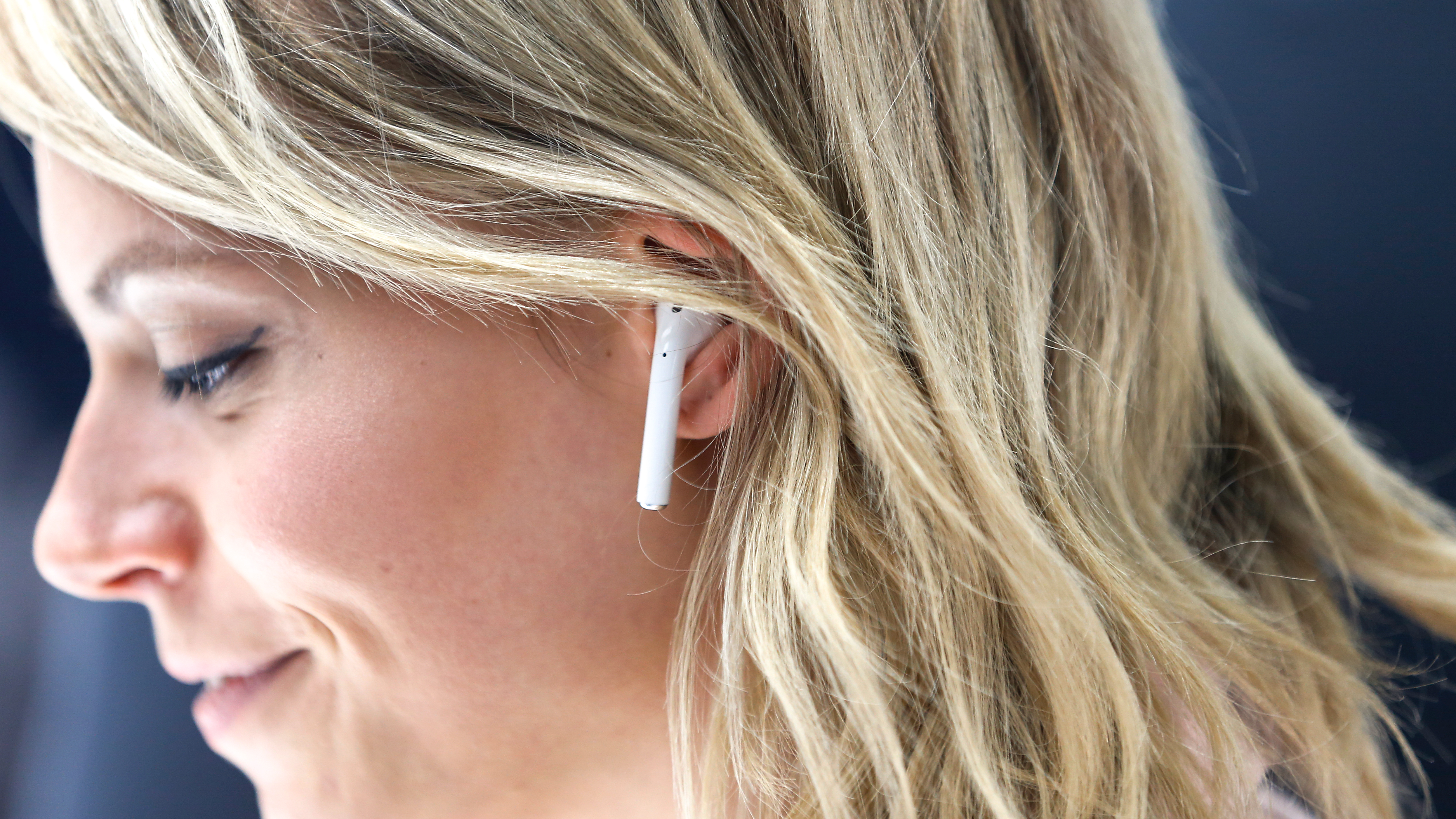 An attendee wears an Apple AirPods during a launch event on September 7, 2016 in San Francisco, California. Apple Inc. unveiled the latest iterations of its smart phone, the iPhone 7 and 7 Plus, the Apple Watch Series 2, as well as AirPods, the tech giant's first wireless headphones. (Photo by Stephen Lam/Getty Images)