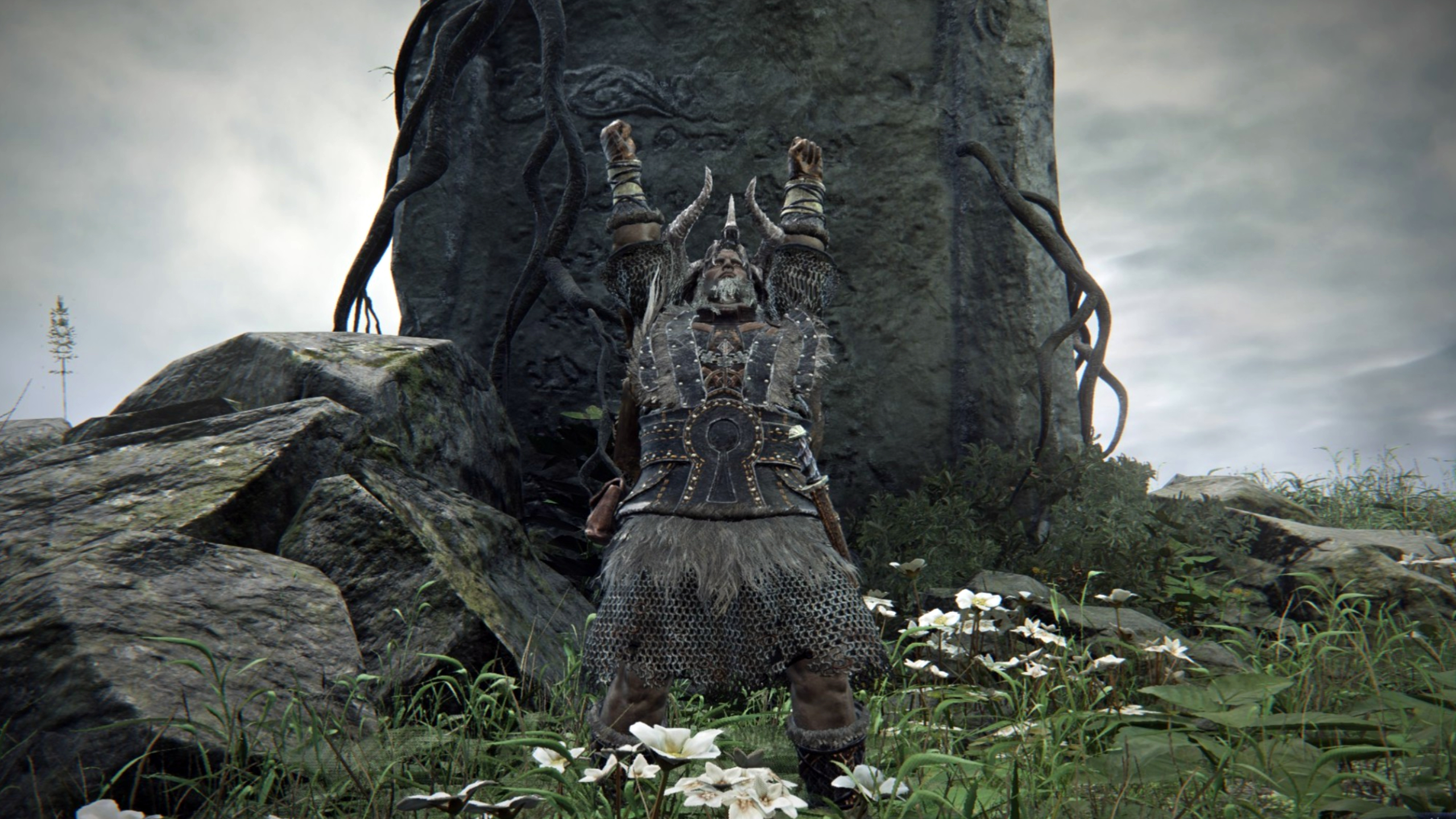 Elden Ring Nightreign Remembrance quests: Raider with his arms raised, standing in front of a large rock.