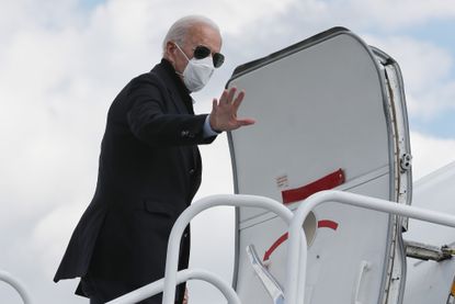 Joe Biden boards a plane